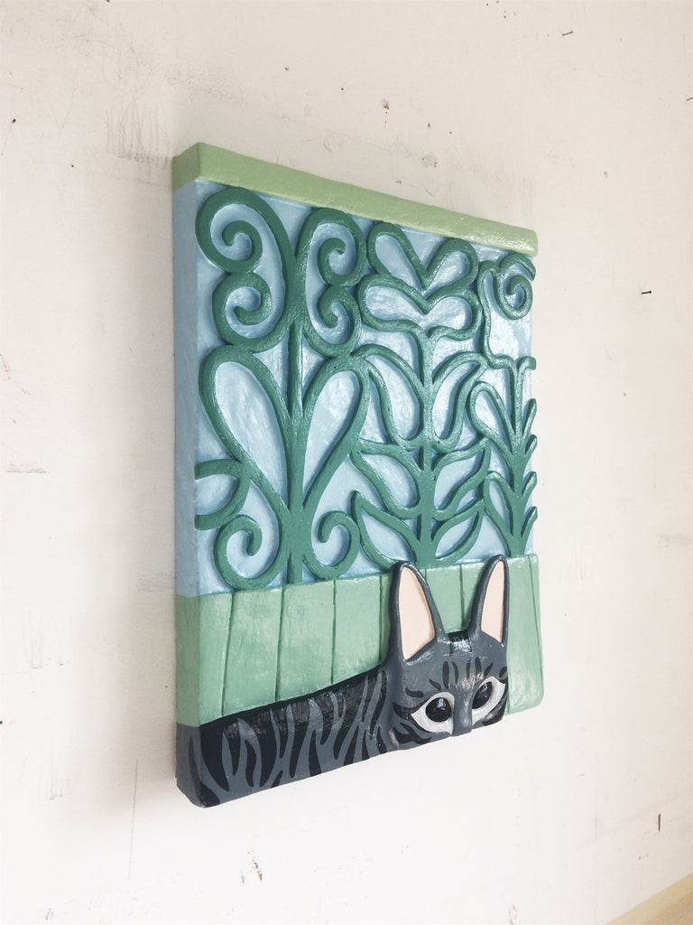 Lá está o gato, à janela do teu quarto