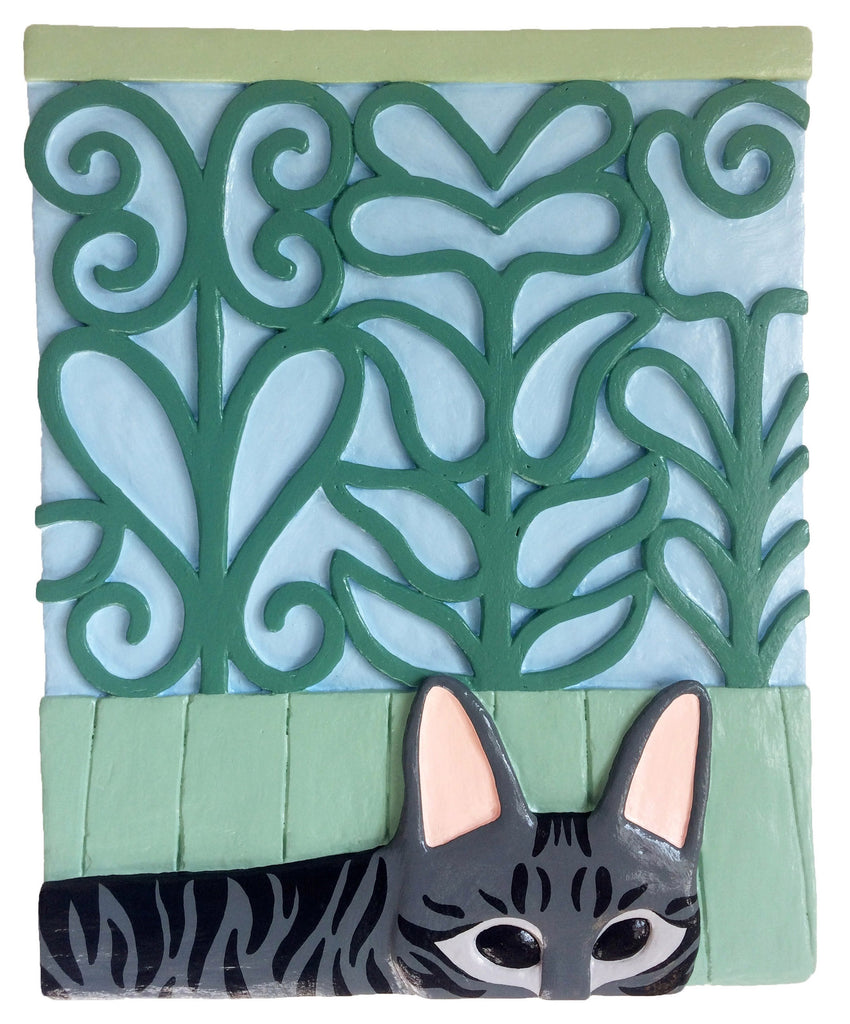 Lá está o gato, à janela do teu quarto