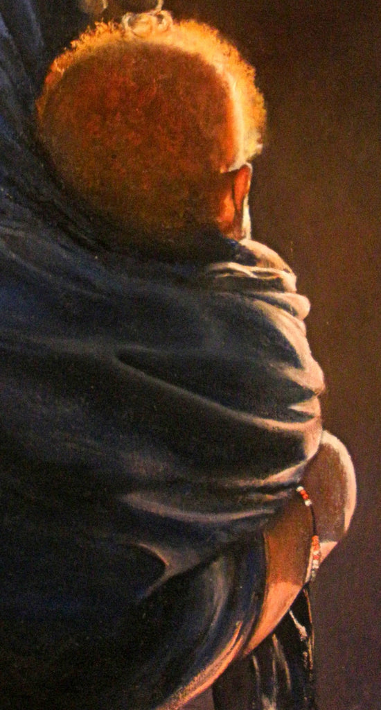 Mujer con niño al ponerse el sol.